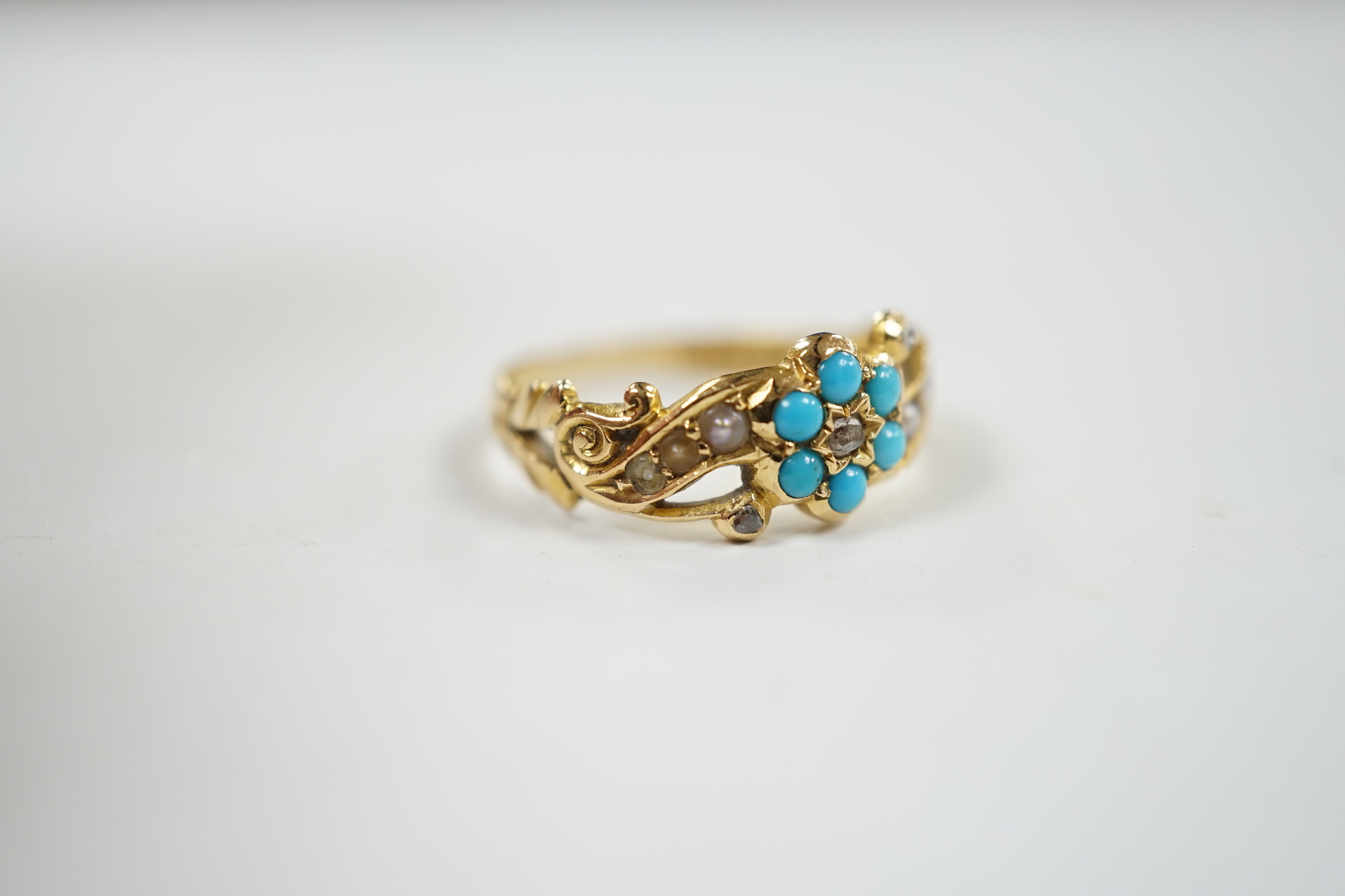 A late Victorian yellow meal, turquoise, rose cut diamond and seed pearl cluster set dress ring, size M, gross weight 3.4 grams.